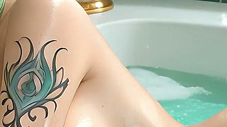 Beautiful Nude Woman with Emerald Crown Braid in Luxury Soapy Bath