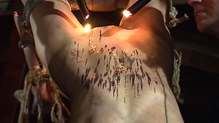 Witch Hangs Upside Down and Gets Drizzled with Black Wax