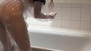 Sue, Cleaning the Bathroom in a Pvc Suit!