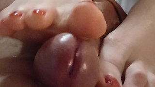 Kelly Performs a Technical Footjob Bringing Dominik's Cock to a Squirting Orgasm.
