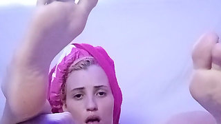 Skinny Girl Applying Oil to Her Body