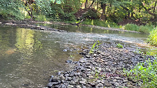 Cute Teen in Costume Playing in the River Like in a Swimming Pool