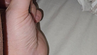 Step mom hand goes under step son leg and grabs his big balls and squeeze them hard