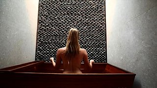 Blonde MILF housewife posing in bikini in the bathroom