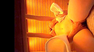 In the sauna, a guy gets caught feeling up some milk cans and fingering a tasty pussy