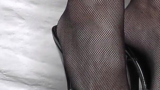 Goddess of High Heels Shows off Her Black Patent Leather Mules