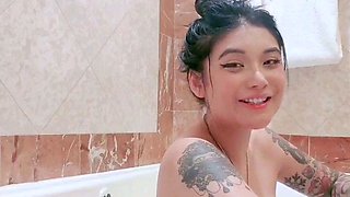 Busty babe playing with her big boobs